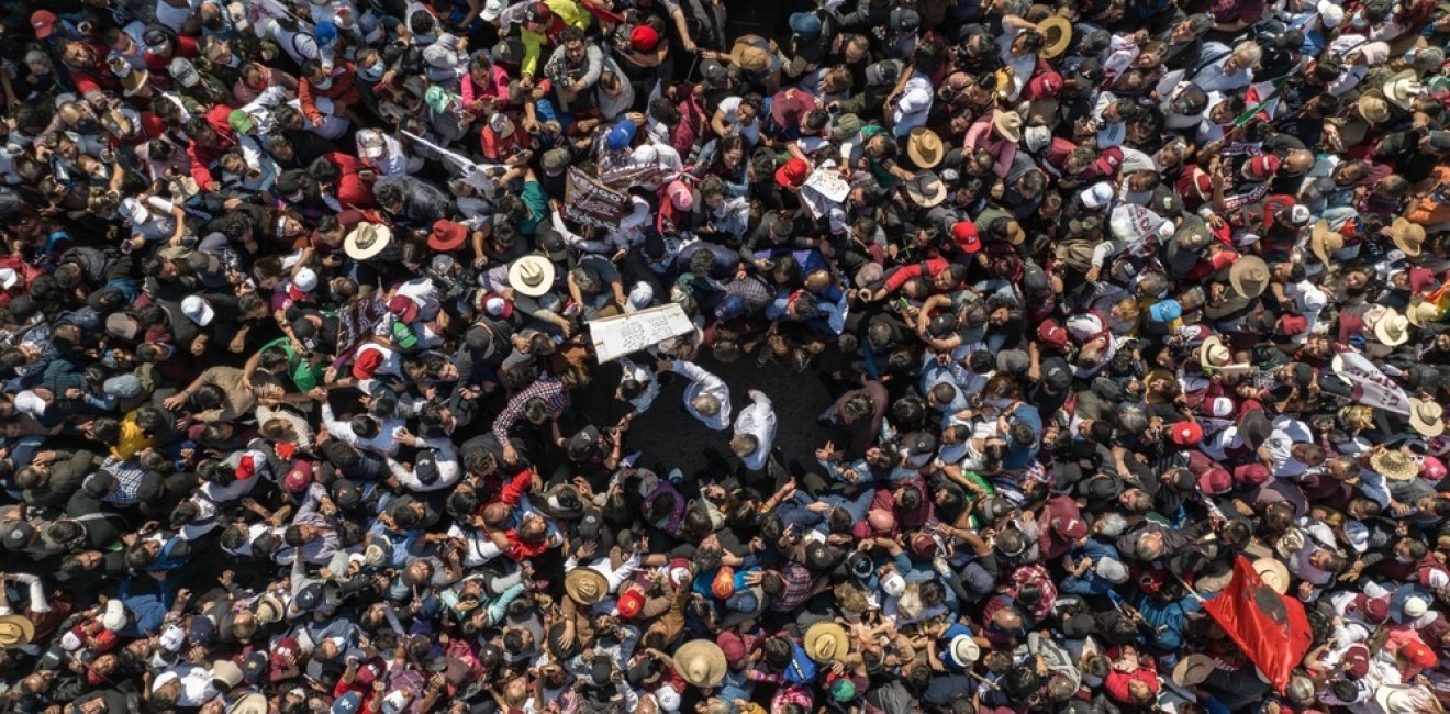 The president of Mexico Andres Manuel Lopez Obrador walking with hundreds of thousands of people towards the zocalo of Mexico City to render his fourth government report.