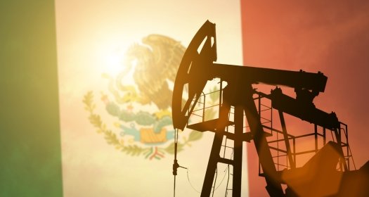 Oil pump on background of flag of Mexico