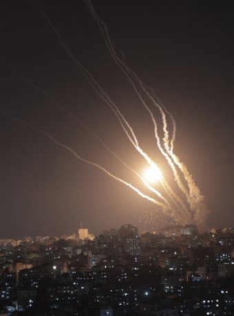 Smoke trails from rockets fired from Gaza at night