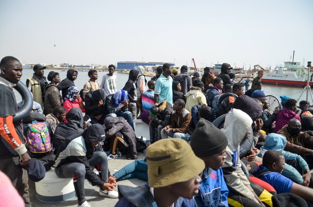 Group of migrants on a boat attempting to cross the Mediterranean