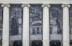 Theater facade, banner showing destroyed Mariupol Theater