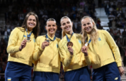 Gold medalists Olena Kravatska, Alina Komashchuk, Olga Kharlan and Yuliya Bakastova during the victory ceremony for the women's team sabre event at the Grand Palais during the 2024 Summer Olympics.